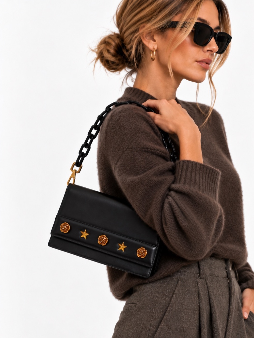 Mo&Co | black leather mini bag with gold hardware star + rose studs chain handle